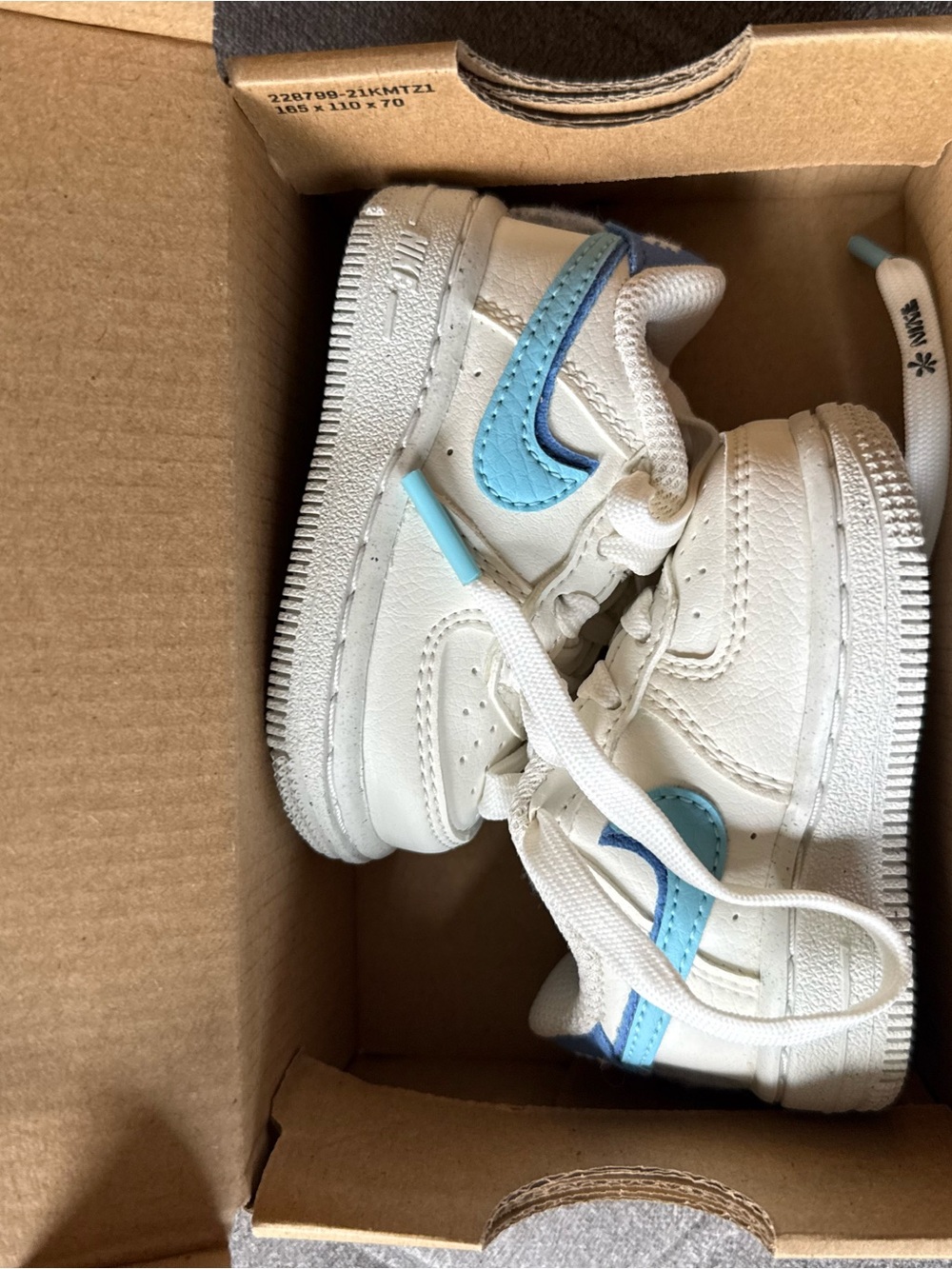 Nike Kids White Sneakers with Light Blue Swoosh